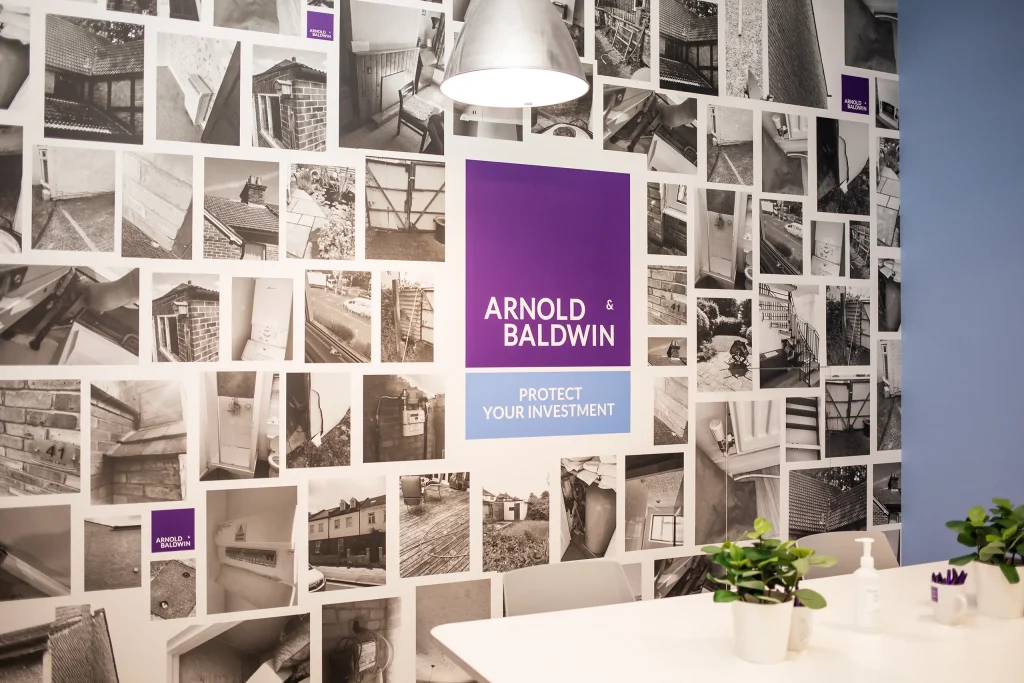 Office wall paper design showing property defects in arnold and baldwin's training room.