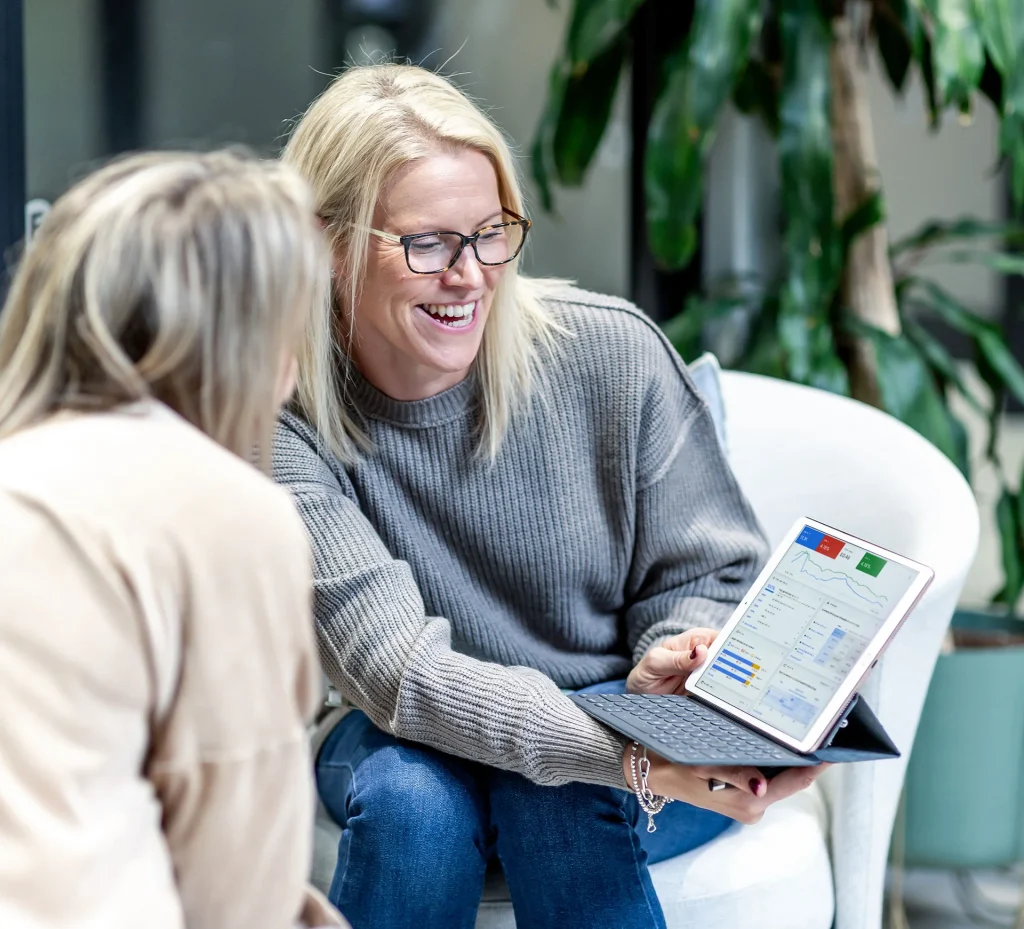 Domonique showing a client their google ads performance report