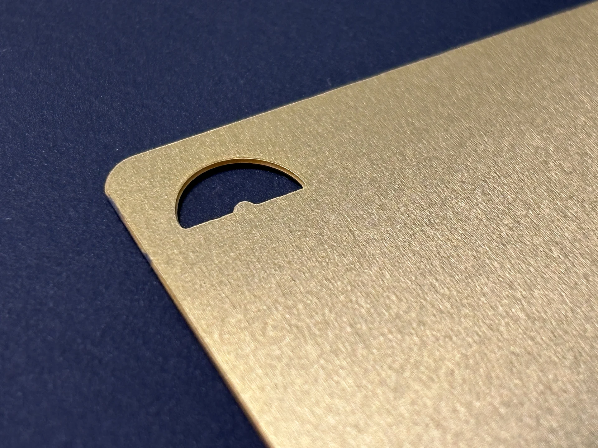 Ja-cs brand mark "arch" laser cut gold business card