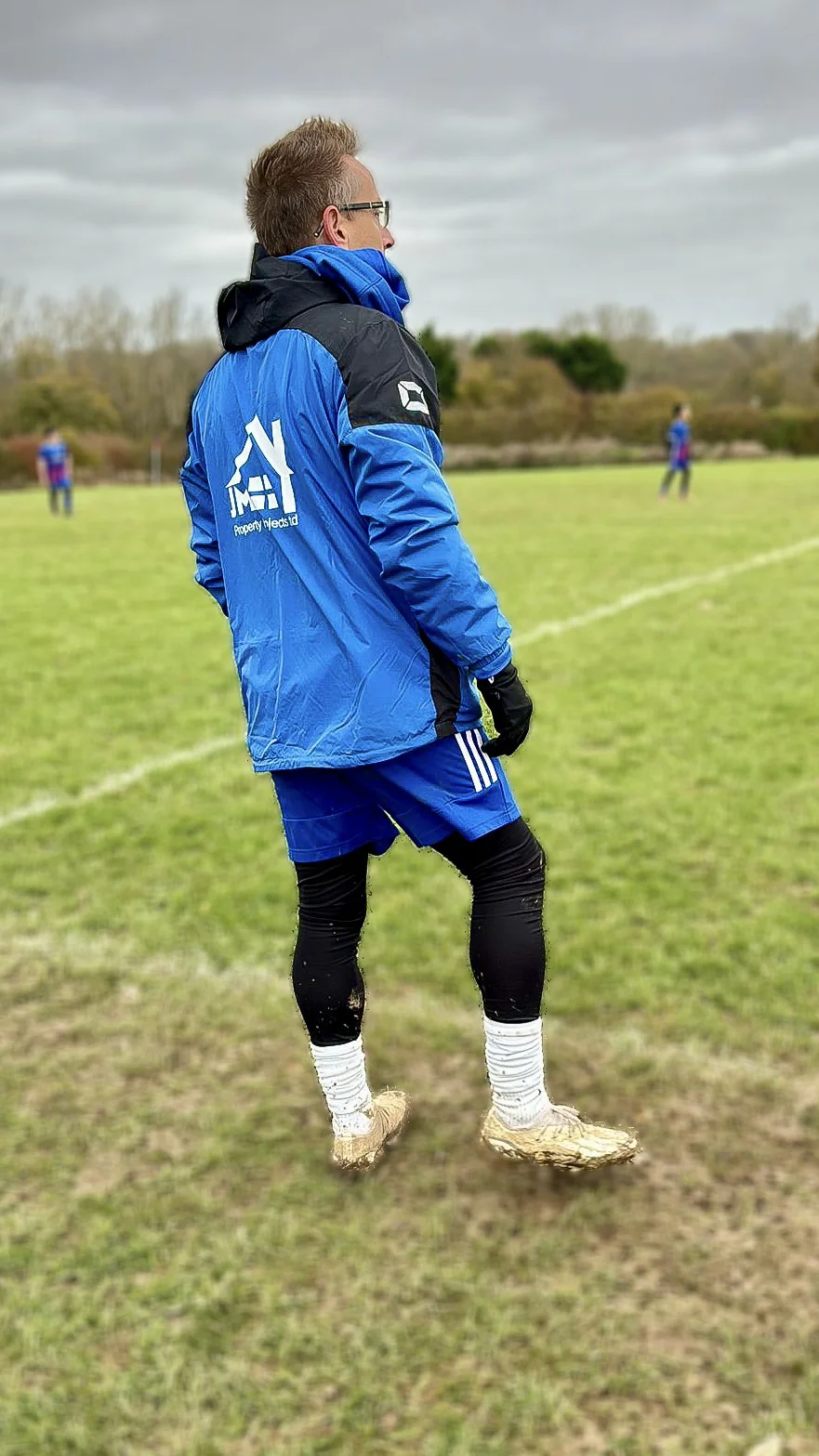 Chris coaching football in winter